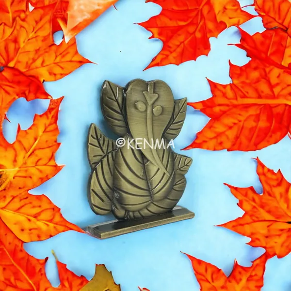 Leaf_Ganesh_Ganpati_Bappa_Murti_Brass_Colour_Idol_Figure_For_Desk_Table_&_Car_Dashboard_Metal_Figure_Accessory_Figurine_Model_1_(6.5_Cm)