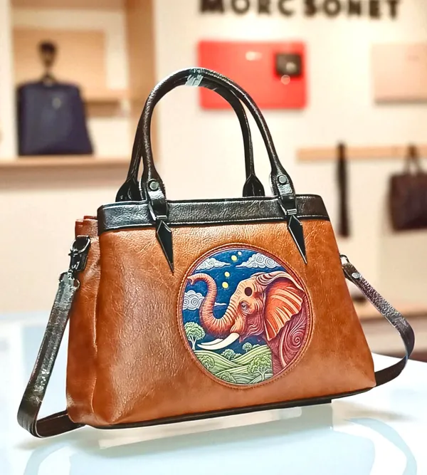 Balenchy Balenchy 𝐕𝐞𝐠𝐚𝐧 𝐋𝐞𝐚𝐭𝐡𝐞𝐫 Satchel Bag with Artistic  𝐄𝐥𝐞𝐩𝐡𝐚𝐧𝐭 Embossed Design, 𝐏𝐫𝐞𝐦𝐢𝐮𝐦 Handcrafted Women’s  Handbag Price in India Buy Balenchy