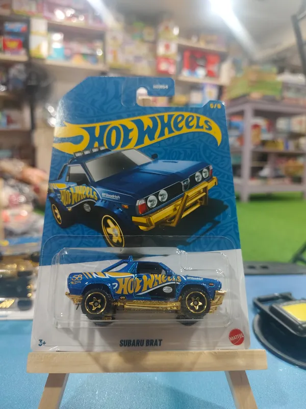 Hot_Wheels_1:64_Scale_SUBARU_BRAT_58th_Anniversary_JKX85_BLUE_AND_GOLD_5/6