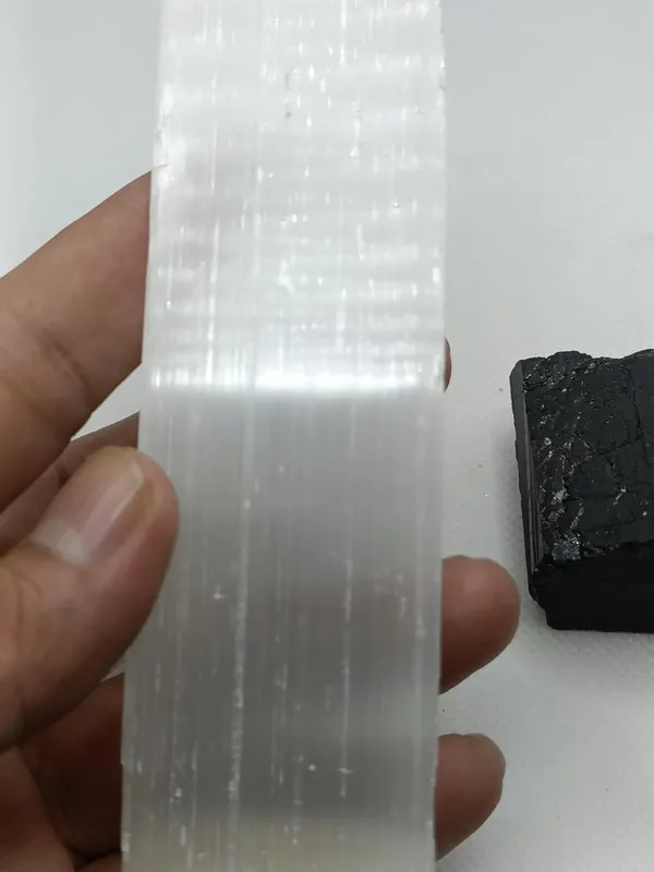 Selenite_Crystal_Stones_And_Black_Tourmaline_Used_For_Remove_Negative_Energy_And_Peace_And_Calm,_Mental_Clarity,_And_Well-Being._(Selenite_And_Black_Tourmaline)