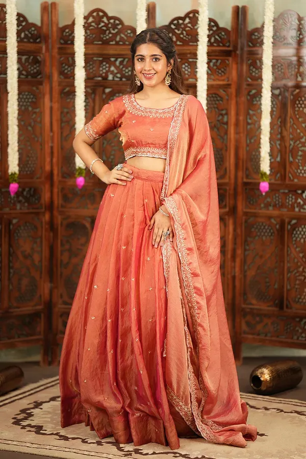 Peach_Coral_Embroidered_Half_Saree_Lehenga_Set_with_Designer_Blouse,_Golden_Booti_Work_&_Elegant_Border_Detail