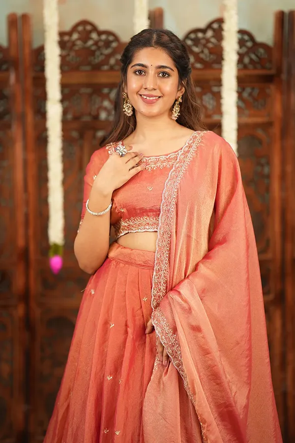 Peach_Coral_Embroidered_Half_Saree_Lehenga_Set_with_Designer_Blouse,_Golden_Booti_Work_&_Elegant_Border_Detail