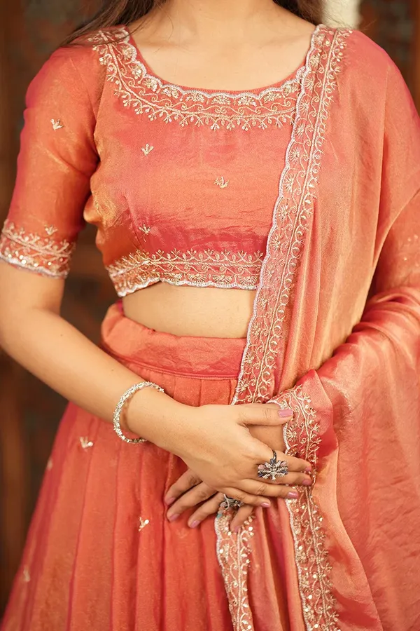 Peach_Coral_Embroidered_Half_Saree_Lehenga_Set_with_Designer_Blouse,_Golden_Booti_Work_&_Elegant_Border_Detail