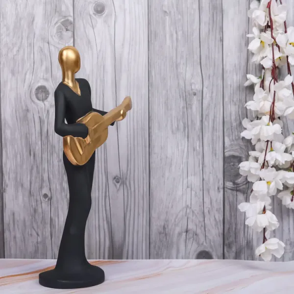 Black_And_Gold_Handcrafted_Resin_Guitar_Women_Player_Showpiece_For_Home_And_Office_Decor_8.9_X_8.9_X_30.5_Cm