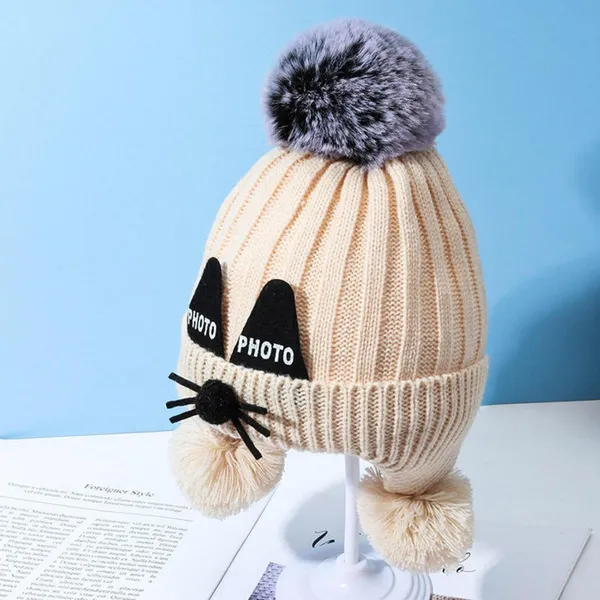 Cream_Knitted_Pom-Pom_Cap_With_Faux_Raccoon_Fur_For_Boys_And_Girls
