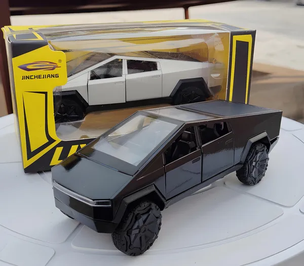Toybot_1:36_Scale_Mini_Cybertruck_Die-Cast_Model_Car,_Pull-Back_Action,_Light_and_Sound_Effects,_Openable_Doors