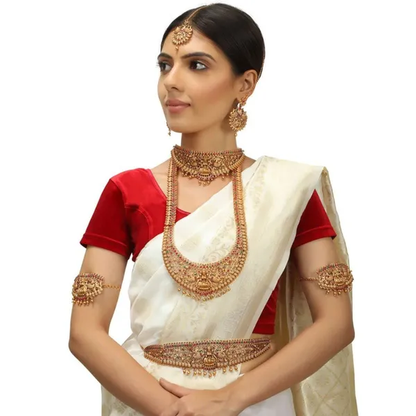 Gold_Set_Of_17_Gold_Plated_Ethnic_Lakshmi_Mata_Motif_Bridal_Temple_Jewellery_Set_With_Necklaces,_Earrings,_Kamarbandh,_Bajubandh,_Maang_Tika_And_Choti_For_Women