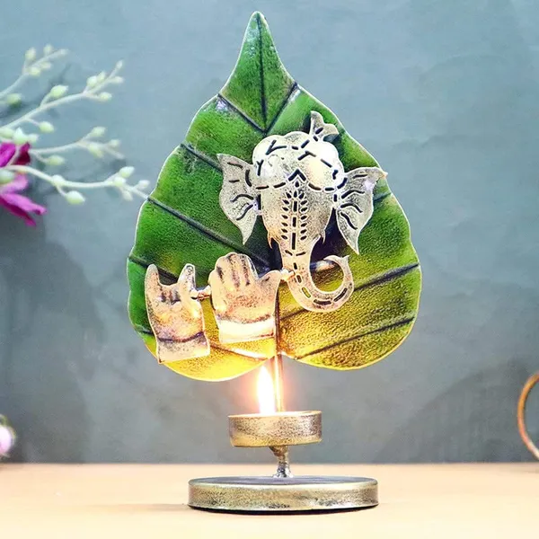 Golden_Handcrafted_Metal_Lord_Ganpati_Playing_Flute_Tabletop_Tealight_Holder_With_Green_Auspicious_Paan/Betel_Leaf_(15_X_7_X_23_Cm)