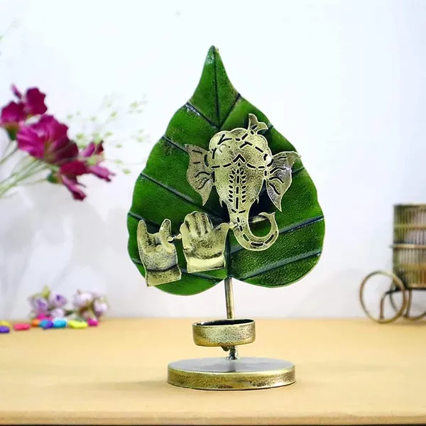Golden_Handcrafted_Metal_Lord_Ganpati_Playing_Flute_Tabletop_Tealight_Holder_With_Green_Auspicious_Paan/Betel_Leaf_(15_X_7_X_23_Cm)