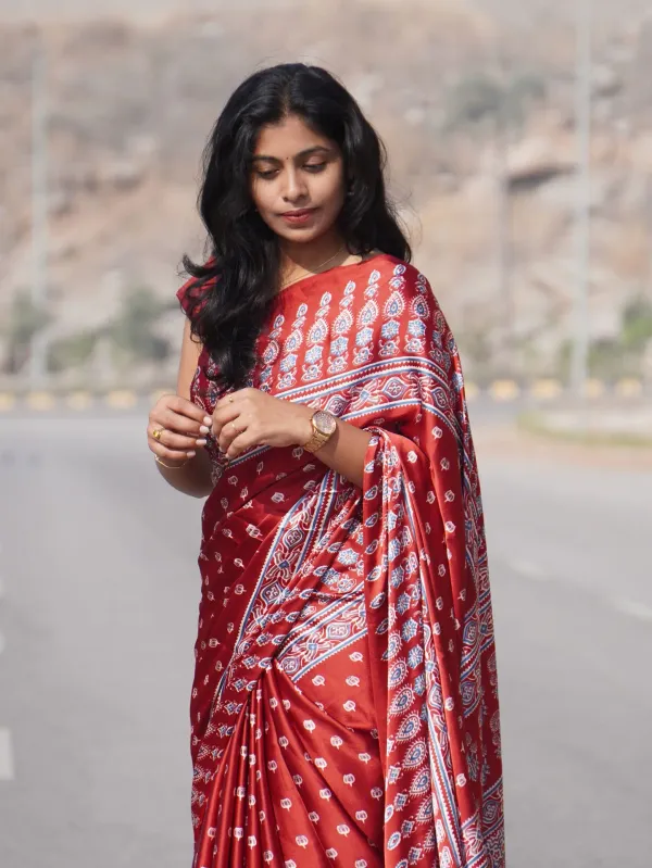 Elegant_Red_Satin_Silk_Saree_with_Designer_Prints_&_Handmade_Tassels_–_Timeless_Elegance