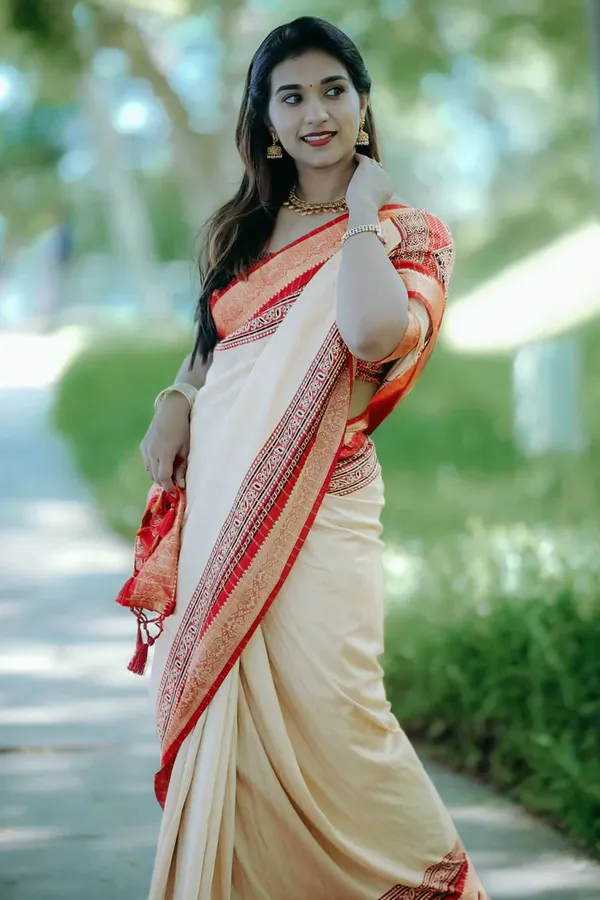 Traditional_Cream_and_Maroon_Saree_with_Elegant_Golden_Weaving_and_Subtle_Border