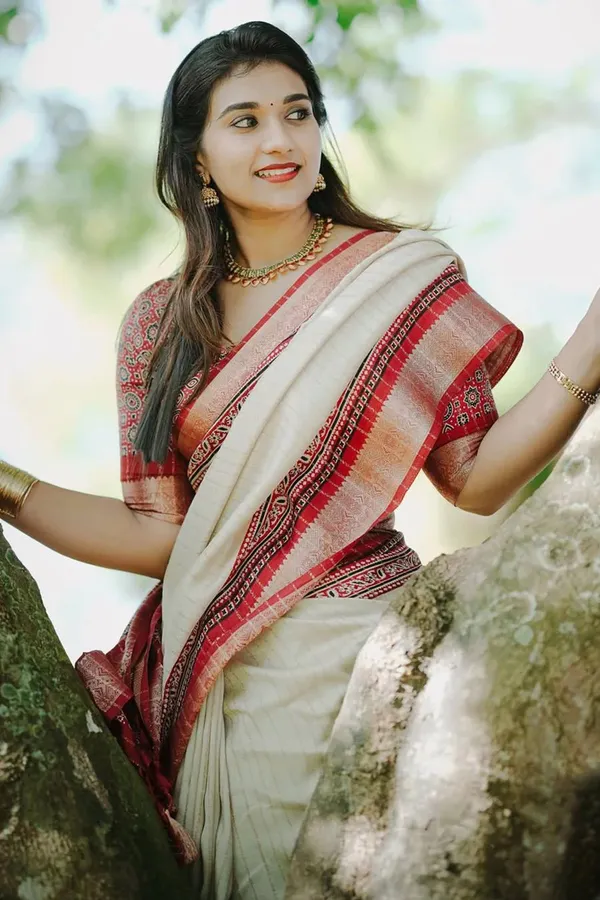 Traditional_Cream_and_Maroon_Saree_with_Elegant_Golden_Weaving_and_Subtle_Border