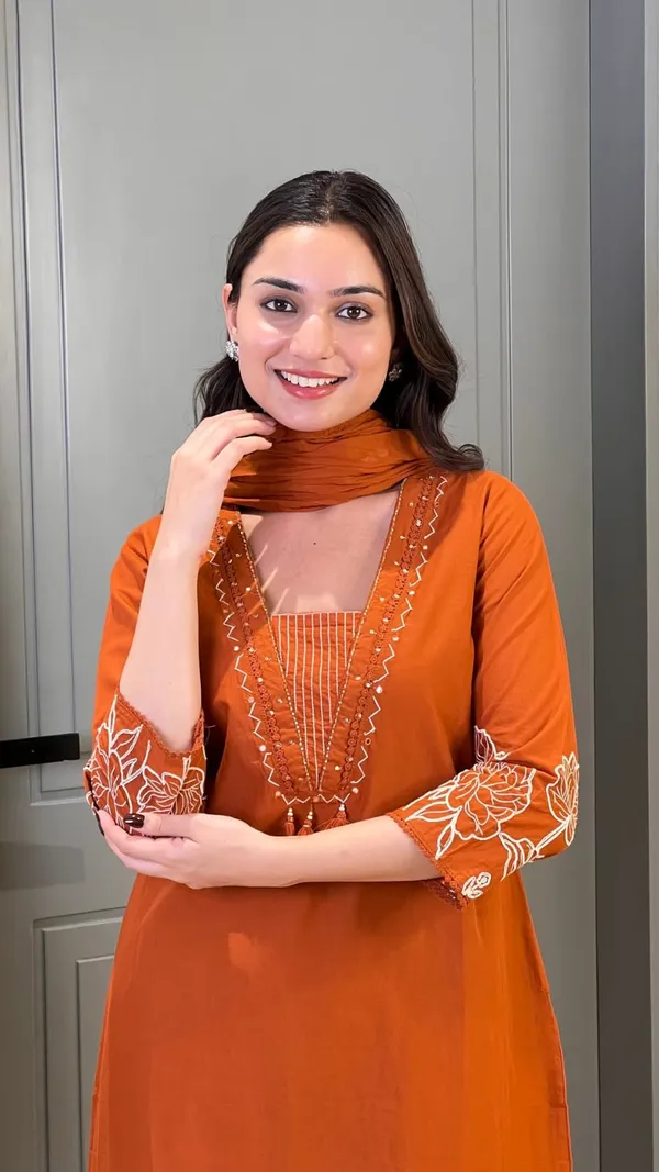 Rust_Orange_Pure_Cotton_Suit_Elevated_with_Fine_Thread_Embroidery_Work_Paired_with_Matching_Pant_and_Dupatta
