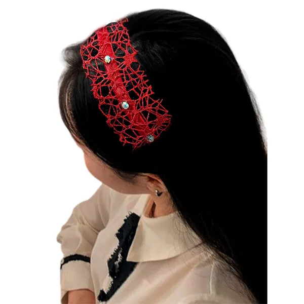 Elegant_ribbon-wrapped_hairband_featuring_shimmering_net_fabric_and_a_crystal_nag_adornment,_adding_sparkle_and_sophistication_to_your_hairstyle.