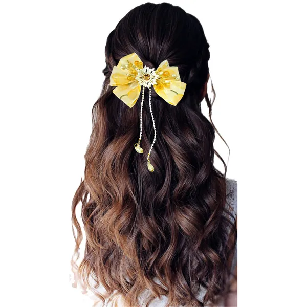 Elegant_three-layered_fabric_hair_bow_with_plastic_flower,_kundan_adornment,_pearl_and_bead_branches,_and_golden_clip_attachment.