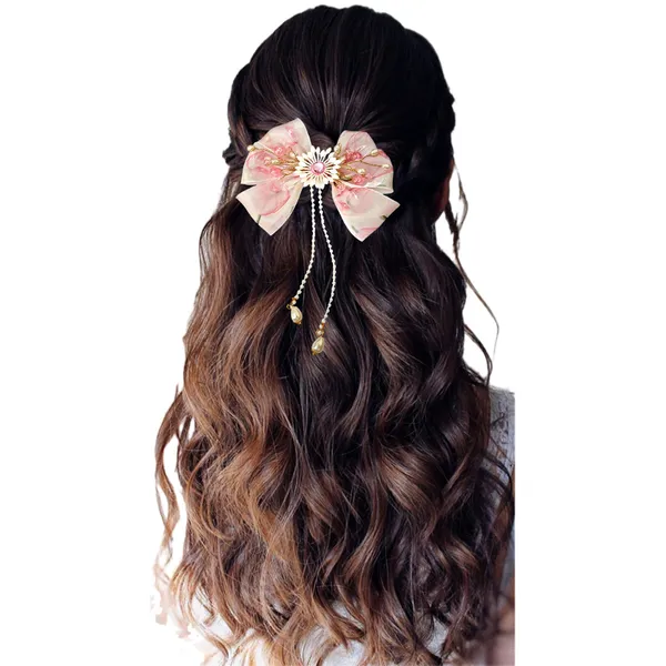 Elegant_three-layered_fabric_hair_bow_with_plastic_flower,_kundan_adornment,_pearl_and_bead_branches,_and_golden_clip_attachment.