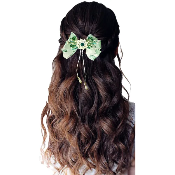 Elegant_three-layered_fabric_hair_bow_with_plastic_flower,_kundan_adornment,_pearl_and_bead_branches,_and_golden_clip_attachment.