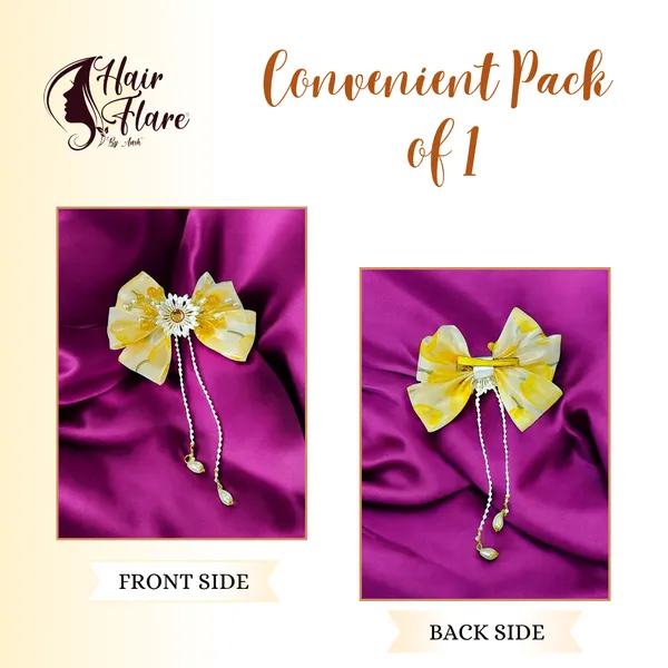 Elegant_three-layered_fabric_hair_bow_with_plastic_flower,_kundan_adornment,_pearl_and_bead_branches,_and_golden_clip_attachment.