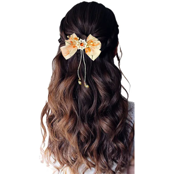 Elegant_three-layered_fabric_hair_bow_with_plastic_flower,_kundan_adornment,_pearl_and_bead_branches,_and_golden_clip_attachment.
