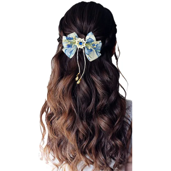 Elegant_three-layered_fabric_hair_bow_with_plastic_flower,_kundan_adornment,_pearl_and_bead_branches,_and_golden_clip_attachment.