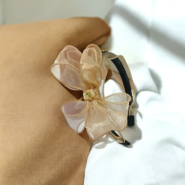 Elegant_Black_Ribbon_Hairband_with_Pearl_Bead_Chain,_Crystal_Adornments,_and_Beautiful_Ribbon_Flower_for_a_Chic_Look