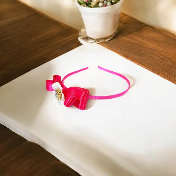 Elevate_your_style_with_our_elegant_hairband,_featuring_a_chic_bow,_stunning_pearl_flower,_and_sparkling_nag_crystals._Lightweight_and_comfortable,_it's_perfect_for_any_occasion_and_suitable_for_all_ages.