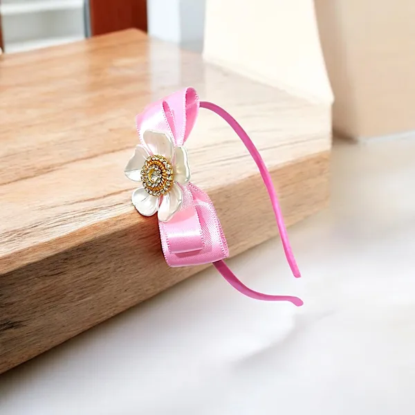 Elevate_your_style_with_our_elegant_hairband,_featuring_a_chic_bow,_stunning_pearl_flower,_and_sparkling_nag_crystals._Lightweight_and_comfortable,_it's_perfect_for_any_occasion_and_suitable_for_all_ages.