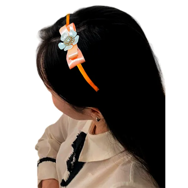 Elevate_your_style_with_our_elegant_hairband,_featuring_a_chic_bow,_stunning_pearl_flower,_and_sparkling_nag_crystals._Lightweight_and_comfortable,_it's_perfect_for_any_occasion_and_suitable_for_all_ages.