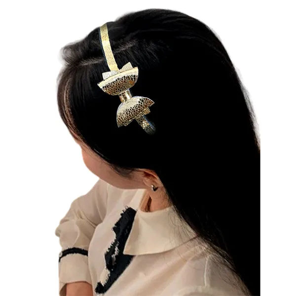 Playful_Sophistication:_Golden_Rexine_Bow_Hair_Band.