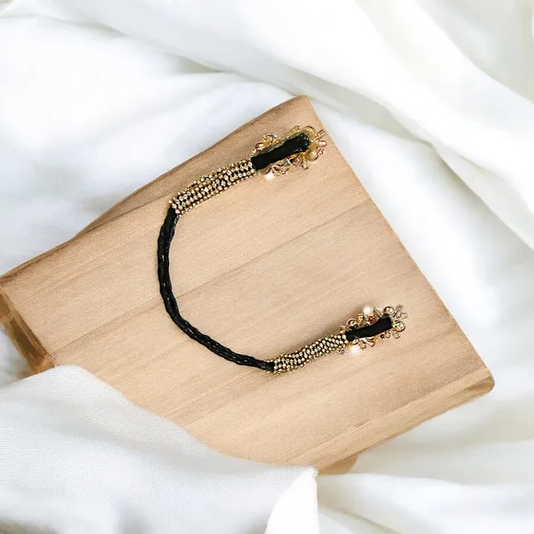 Stunning_Black_Juda_Piece_with_Elegant_Pearl_and_Tilak_Crystal_Accents:_A_Handcrafted_Hair_Accessory_Perfect_for_Weddings,_Festivals,_and_Everyday_Style���������Combining_Comfort,_Durability,_and_Timeless_Beauty.
