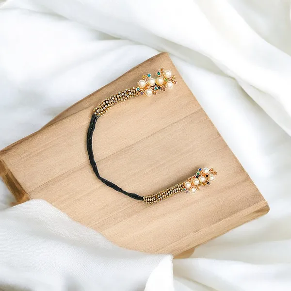Stunning_Black_Juda_Piece_with_Elegant_Pearl_and_Tilak_Crystal_Accents:_A_Handcrafted_Hair_Accessory_Perfect_for_Weddings,_Festivals,_and_Everyday_Style���������Combining_Comfort,_Durability,_and_Timeless_Beauty.