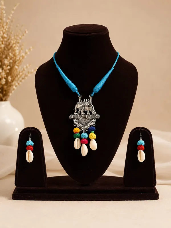 Handmade_Tribal_Elephant_Pendant_Necklace_Set_for_Women_|_Blue_Thread_Cord,_German_Silver_Pendant,_Cowrie_Shell_&_Matching_Earrings_|_Boho_Ethnic_Jewellery