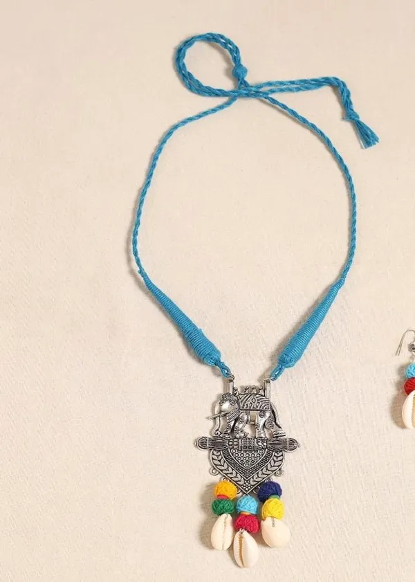 Handmade_Tribal_Elephant_Pendant_Necklace_Set_for_Women_|_Blue_Thread_Cord,_German_Silver_Pendant,_Cowrie_Shell_&_Matching_Earrings_|_Boho_Ethnic_Jewellery