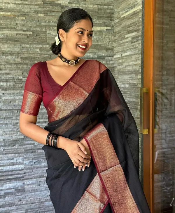 Elegant_Black_and_Maroon_Saree_with_Intricate_Gold_Patterns_and_Designer_Blouse