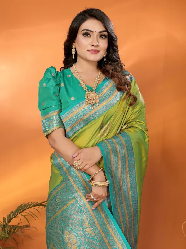 Pista_Green_Banarasi_Silk_Saree_with_Contrast_Blue_Zari_Border_and_Traditional_Motifs