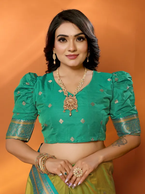Pista_Green_Banarasi_Silk_Saree_with_Contrast_Blue_Zari_Border_and_Traditional_Motifs