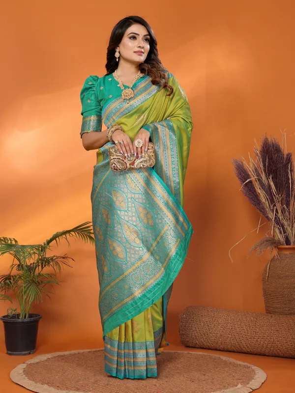 Pista_Green_Banarasi_Silk_Saree_with_Contrast_Blue_Zari_Border_and_Traditional_Motifs