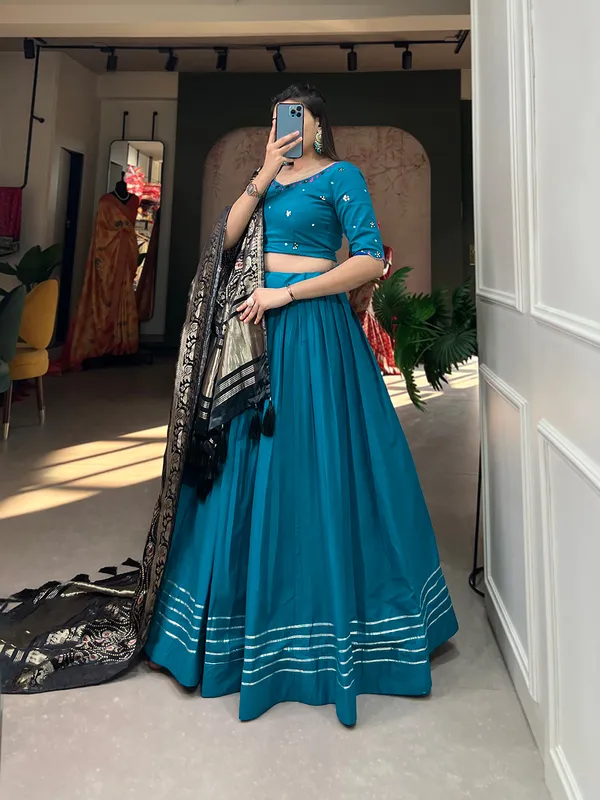 Step_into_a_world_of_elegance_and_grace_with_the_delicate_charm_of_pure_cotton_lehenga_and_the_lustrous_allure_of_gaji_silk_dupatta