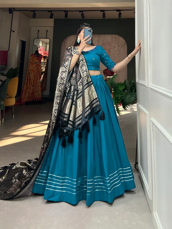 Step_into_a_world_of_elegance_and_grace_with_the_delicate_charm_of_pure_cotton_lehenga_and_the_lustrous_allure_of_gaji_silk_dupatta