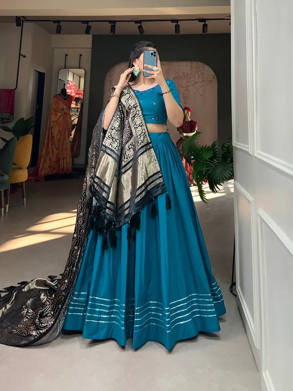 Step_into_a_world_of_elegance_and_grace_with_the_delicate_charm_of_pure_cotton_lehenga_and_the_lustrous_allure_of_gaji_silk_dupatta