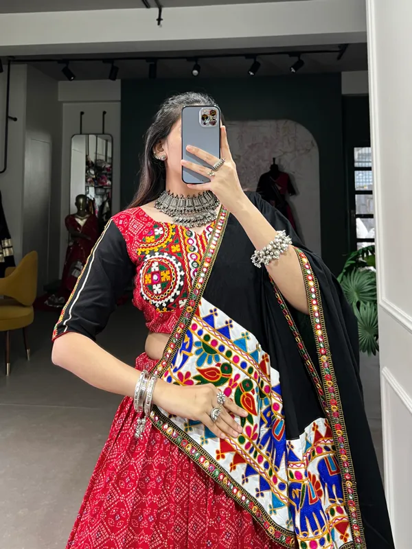 Wear_this_beautiful_masterpiece_of_garba_choli_embellishes_with_gamthi_work_and_mirror_work_touch_up_to_make_everyone_feel_the_stories_of_Navratri_traditions