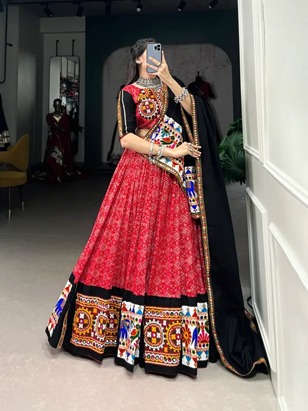 Wear_this_beautiful_masterpiece_of_garba_choli_embellishes_with_gamthi_work_and_mirror_work_touch_up_to_make_everyone_feel_the_stories_of_Navratri_traditions