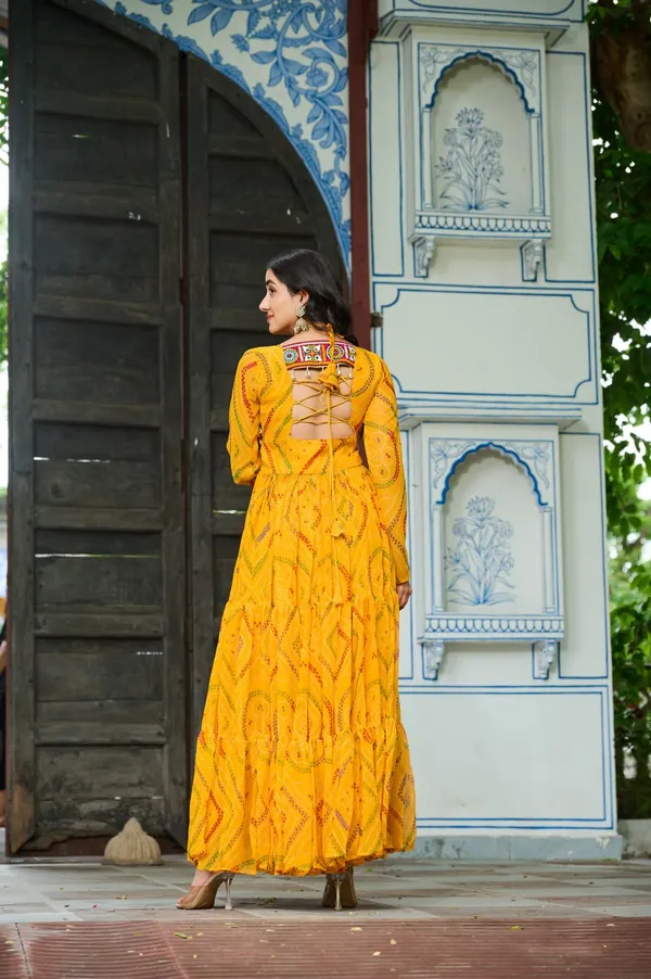 Celebrate_this_Navratri_in_full_color_and_culture_with_our_stunning_traditional_maxi_dresses._Featuring_bold_Bandhani_prints_and_handcrafted_mirror-work_yokes,_each_outfit_radiates_ethnic_charm._Choose_your_festive_hue_—_Sunshine_Yellow,_Royal_Purple,_Electric_Blue,_or_Fiery_Red_—_and_dance_through_the_nights_in_comfort_and_elegance.