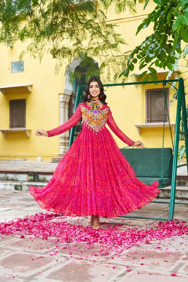 Celebrate_this_Navratri_in_full_color_and_culture_with_our_stunning_traditional_maxi_dresses._Featuring_bold_Bandhani_prints_and_handcrafted_mirror-work_yokes,_each_outfit_radiates_ethnic_charm._Choose_your_festive_hue_—_Sunshine_Yellow,_Royal_Purple,_Electric_Blue,_or_Fiery_Red_—_and_dance_through_the_nights_in_comfort_and_elegance.