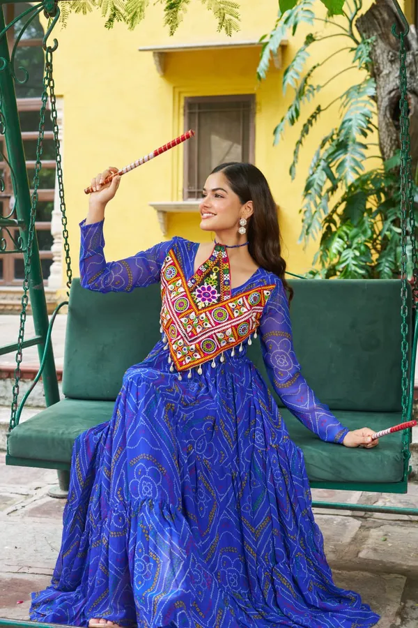 Celebrate_this_Navratri_in_full_color_and_culture_with_our_stunning_traditional_maxi_dresses._Featuring_bold_Bandhani_prints_and_handcrafted_mirror-work_yokes,_each_outfit_radiates_ethnic_charm._Choose_your_festive_hue_—_Sunshine_Yellow,_Royal_Purple,_Electric_Blue,_or_Fiery_Red_—_and_dance_through_the_nights_in_comfort_and_elegance.