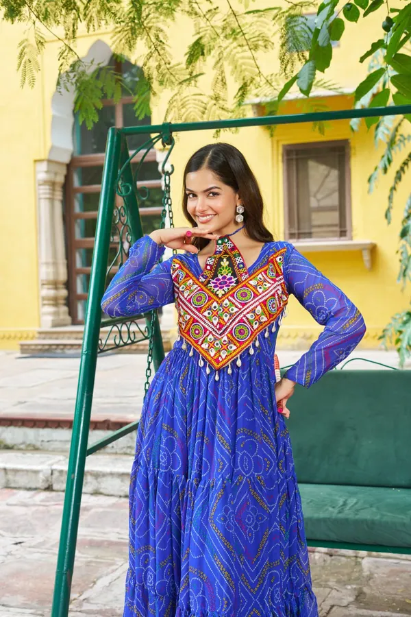 Celebrate_this_Navratri_in_full_color_and_culture_with_our_stunning_traditional_maxi_dresses._Featuring_bold_Bandhani_prints_and_handcrafted_mirror-work_yokes,_each_outfit_radiates_ethnic_charm._Choose_your_festive_hue_—_Sunshine_Yellow,_Royal_Purple,_Electric_Blue,_or_Fiery_Red_—_and_dance_through_the_nights_in_comfort_and_elegance.