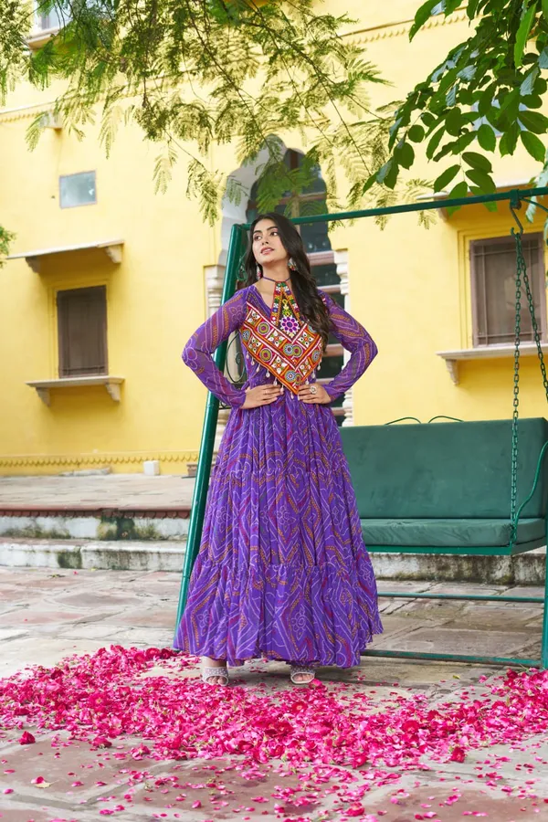 Celebrate_this_Navratri_in_full_color_and_culture_with_our_stunning_traditional_maxi_dresses._Featuring_bold_Bandhani_prints_and_handcrafted_mirror-work_yokes,_each_outfit_radiates_ethnic_charm._Choose_your_festive_hue_—_Sunshine_Yellow,_Royal_Purple,_Electric_Blue,_or_Fiery_Red_—_and_dance_through_the_nights_in_comfort_and_elegance.