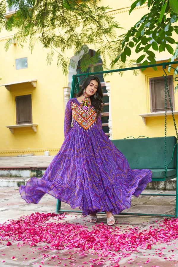 Celebrate_this_Navratri_in_full_color_and_culture_with_our_stunning_traditional_maxi_dresses._Featuring_bold_Bandhani_prints_and_handcrafted_mirror-work_yokes,_each_outfit_radiates_ethnic_charm._Choose_your_festive_hue_—_Sunshine_Yellow,_Royal_Purple,_Electric_Blue,_or_Fiery_Red_—_and_dance_through_the_nights_in_comfort_and_elegance.