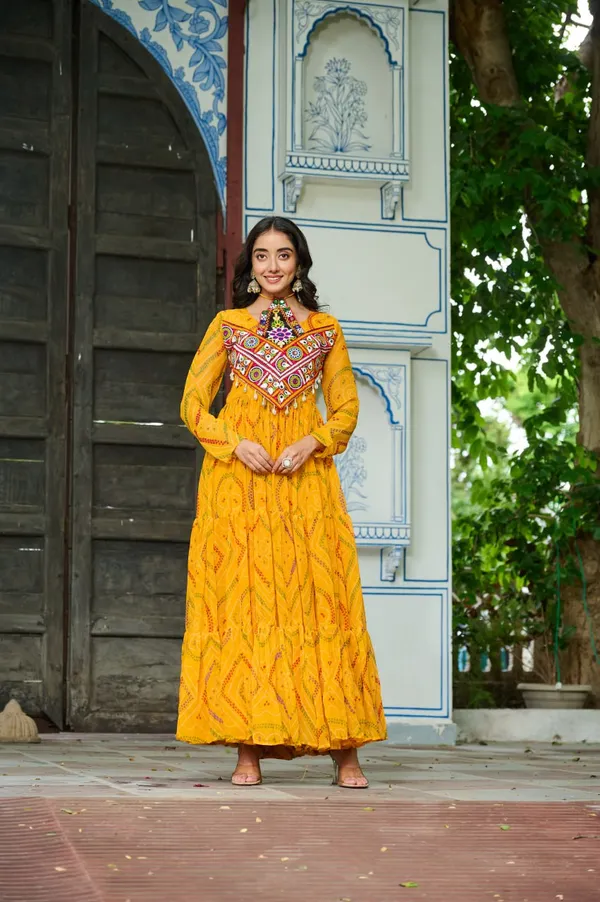 Celebrate_this_Navratri_in_full_color_and_culture_with_our_stunning_traditional_maxi_dresses._Featuring_bold_Bandhani_prints_and_handcrafted_mirror-work_yokes,_each_outfit_radiates_ethnic_charm._Choose_your_festive_hue_—_Sunshine_Yellow,_Royal_Purple,_Electric_Blue,_or_Fiery_Red_—_and_dance_through_the_nights_in_comfort_and_elegance.