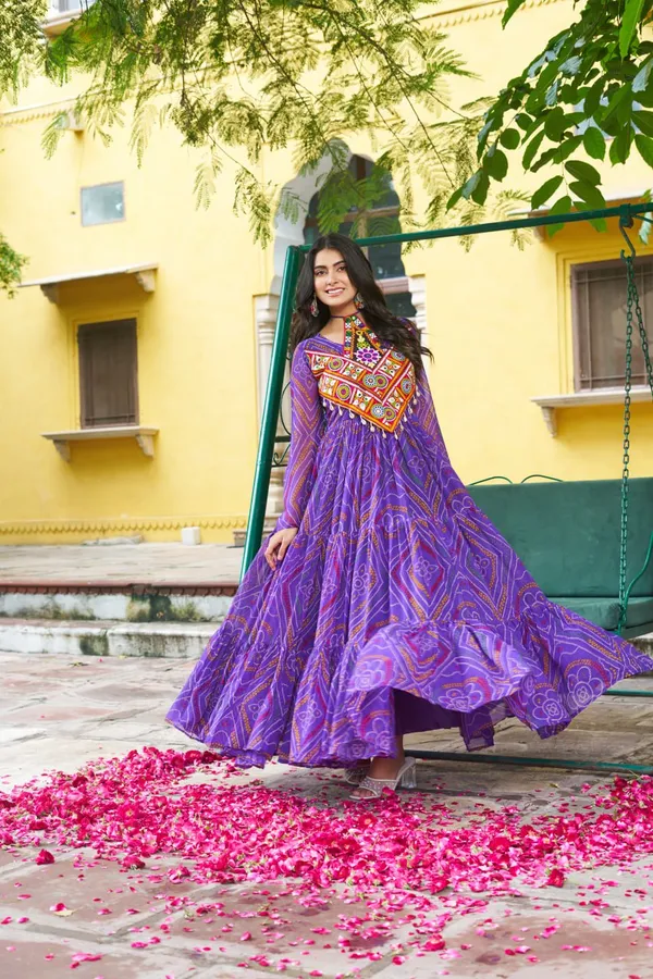 Celebrate_this_Navratri_in_full_color_and_culture_with_our_stunning_traditional_maxi_dresses._Featuring_bold_Bandhani_prints_and_handcrafted_mirror-work_yokes,_each_outfit_radiates_ethnic_charm._Choose_your_festive_hue_—_Sunshine_Yellow,_Royal_Purple,_Electric_Blue,_or_Fiery_Red_—_and_dance_through_the_nights_in_comfort_and_elegance.